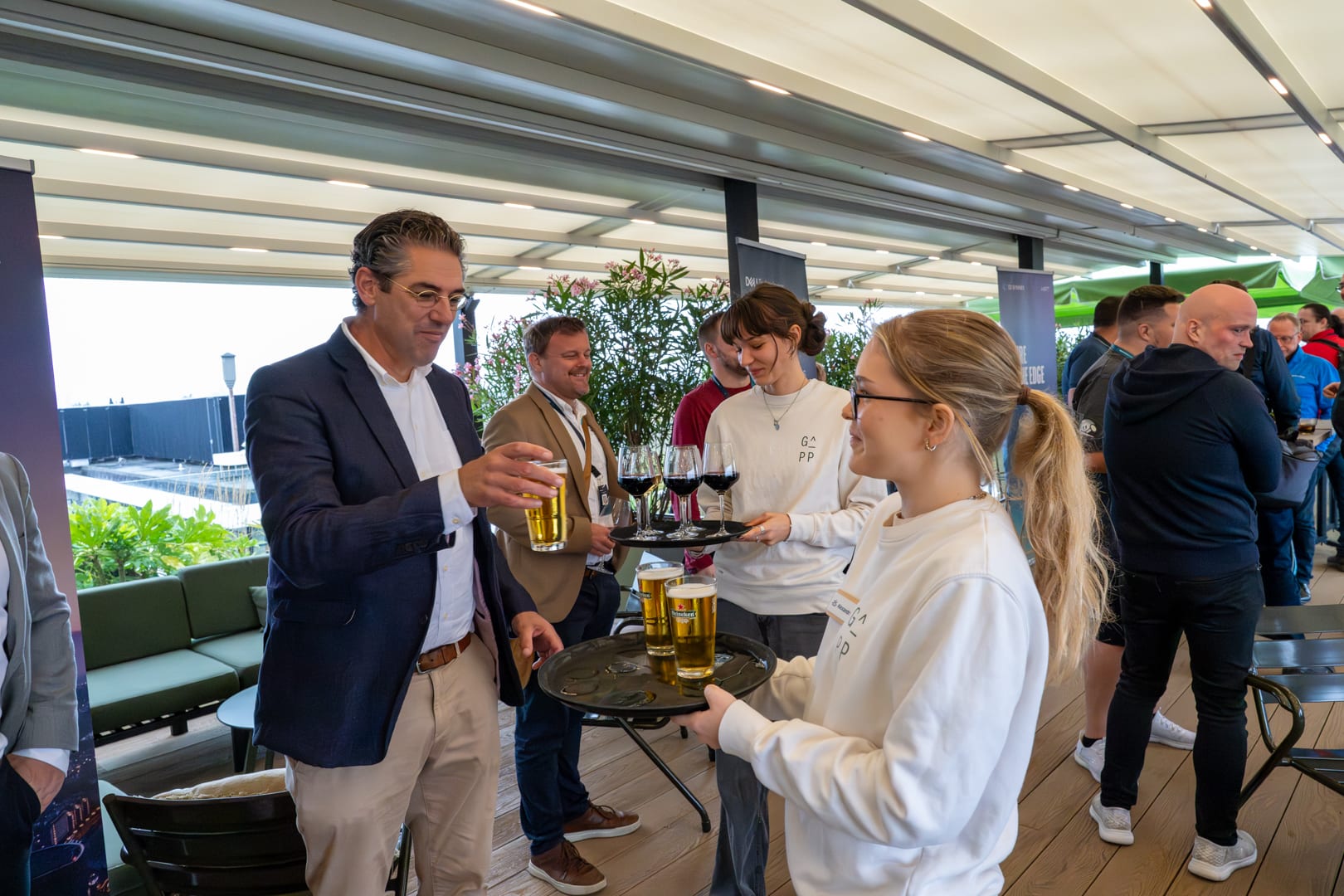 Drinks being handed out on the rooftop