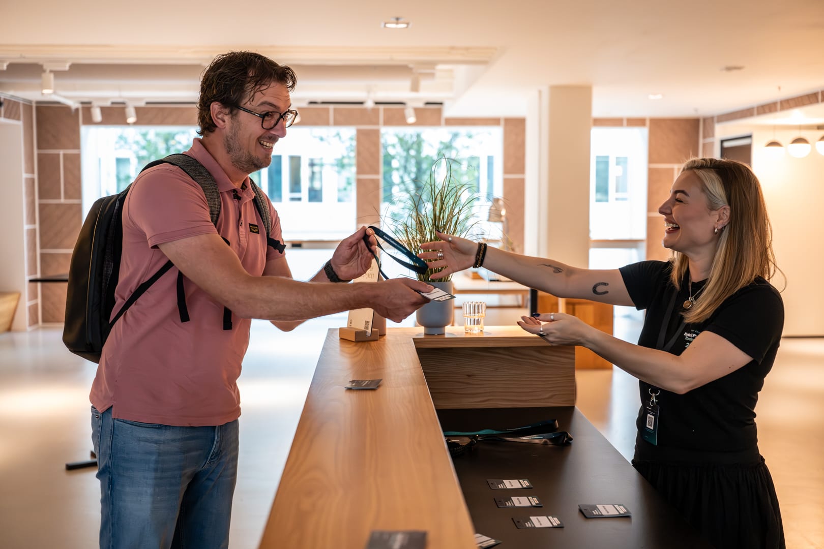 An attendee collecting their badge at check-in
